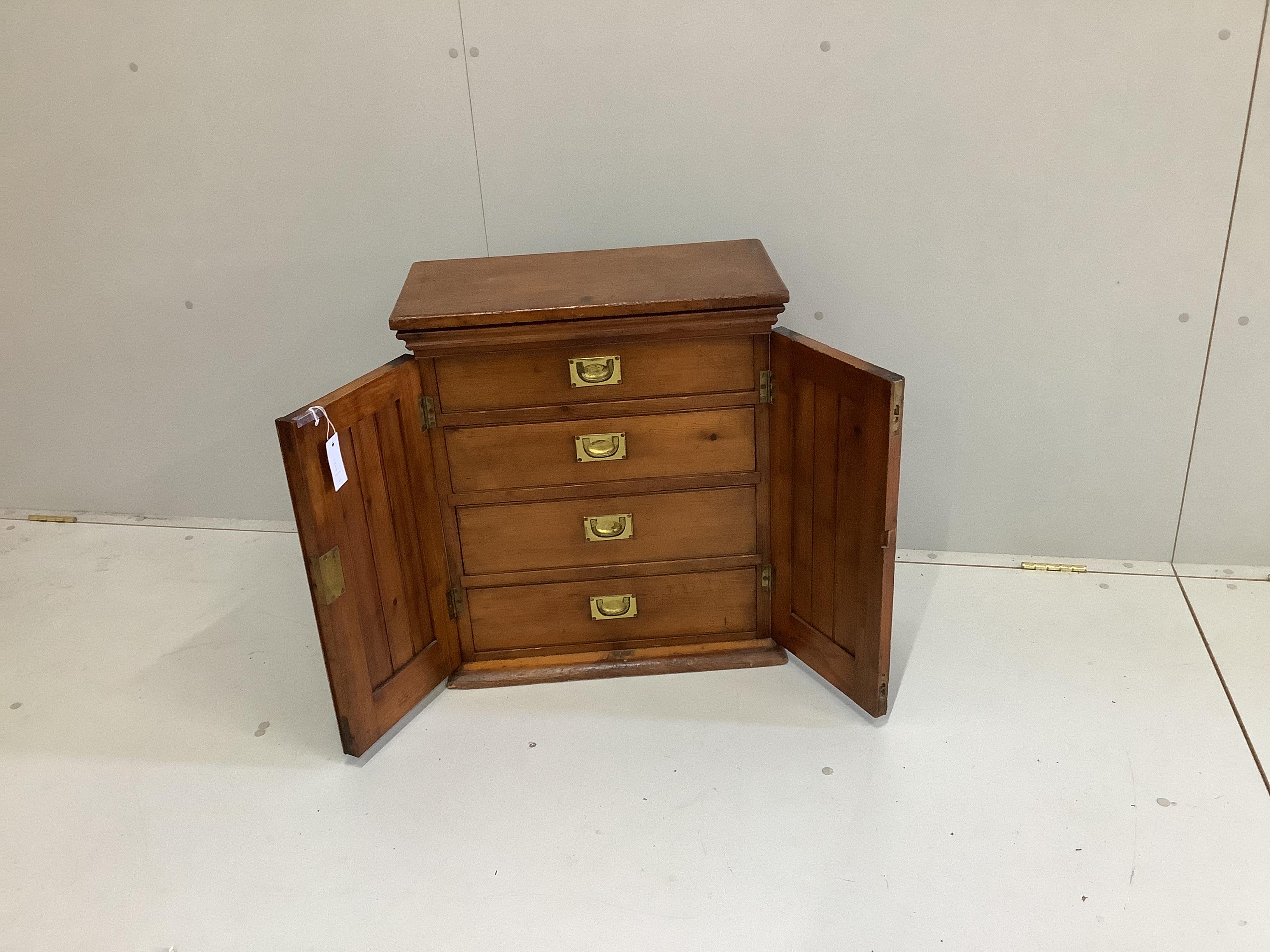 A Victorian pitch pine four drawer collectors' cabinet, width 55cm, depth 27cm, height 63cm